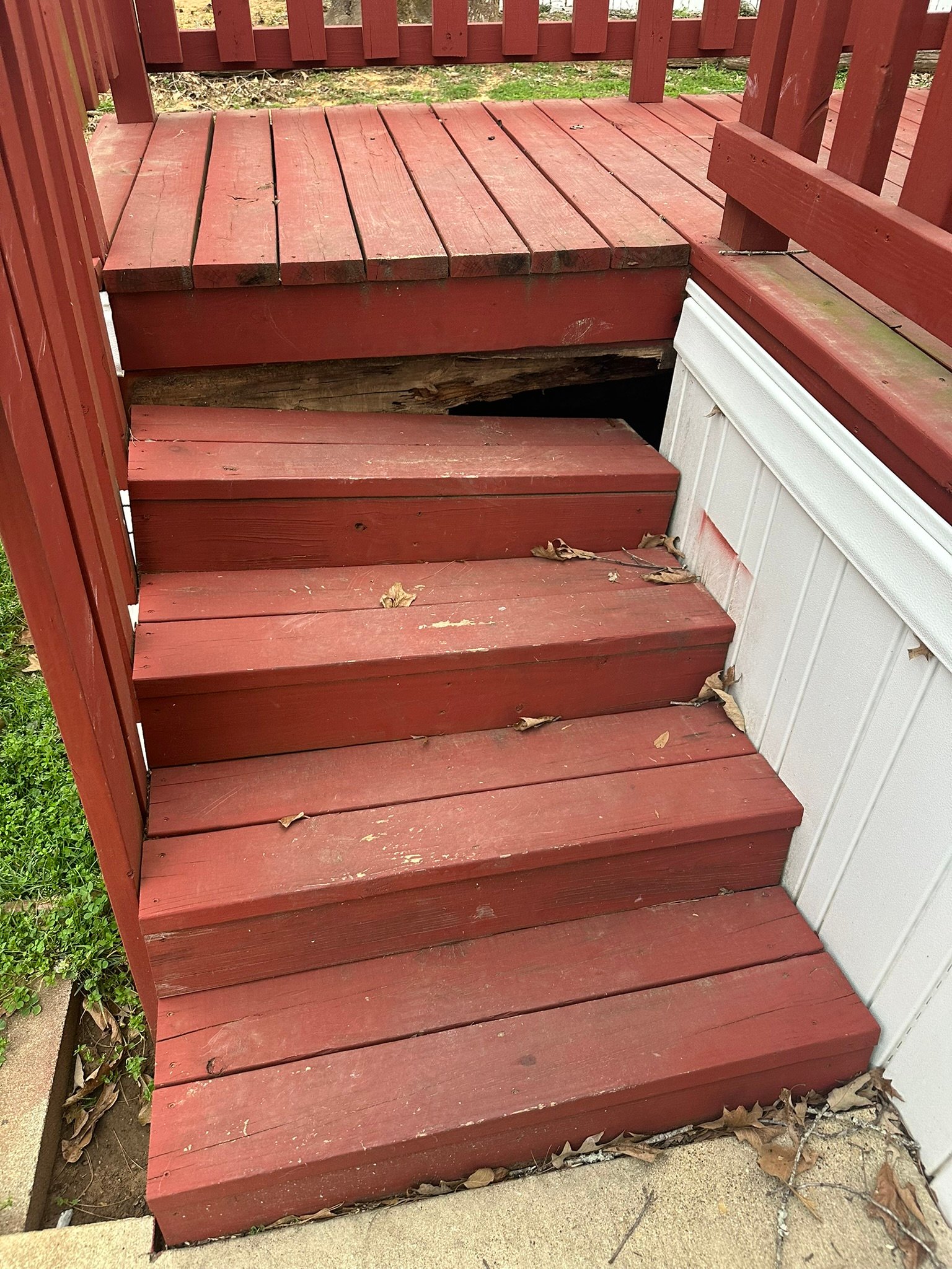 Deck stair repair showing damaged wood being replaced